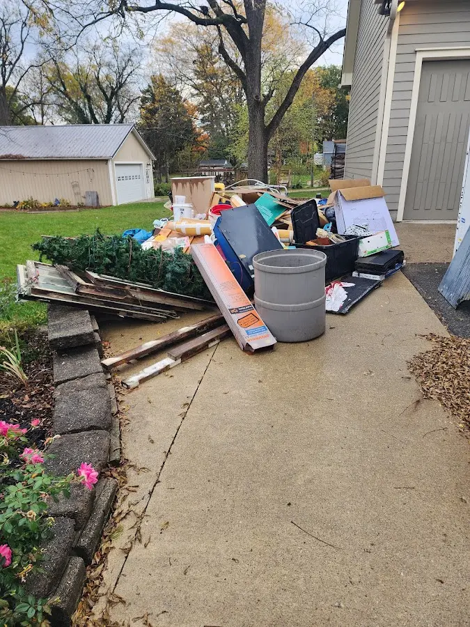 Dumpster being loaded with debris for 12 Yard Dumpster Rental in Somers